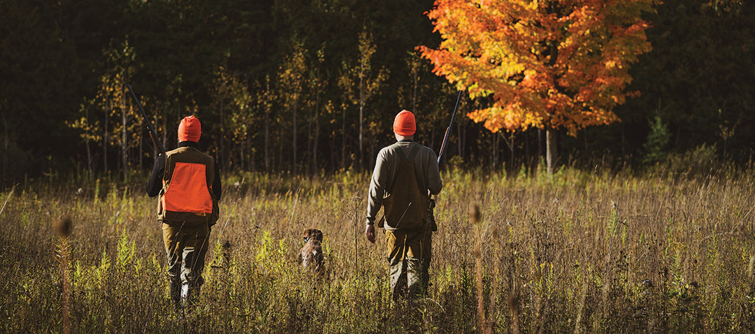 men hunting in the fall wearing merino wool base layers and beanies 